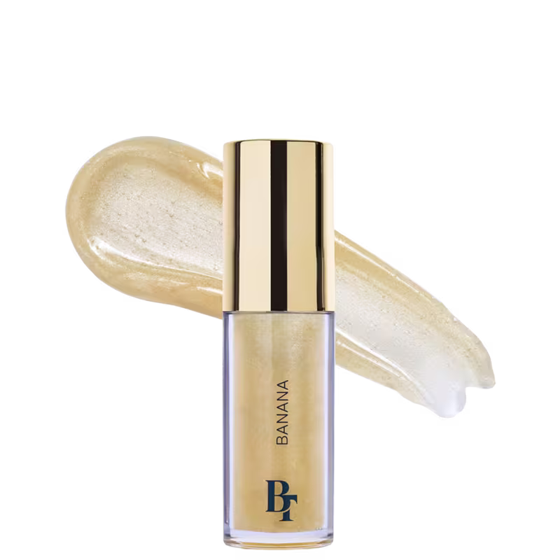 Gloss Labial de Bruna Tavares BT Banana Jelly Oil, com 6ml, em embalagem transparente, interior com detalhes em azul e tampa dourada. 
