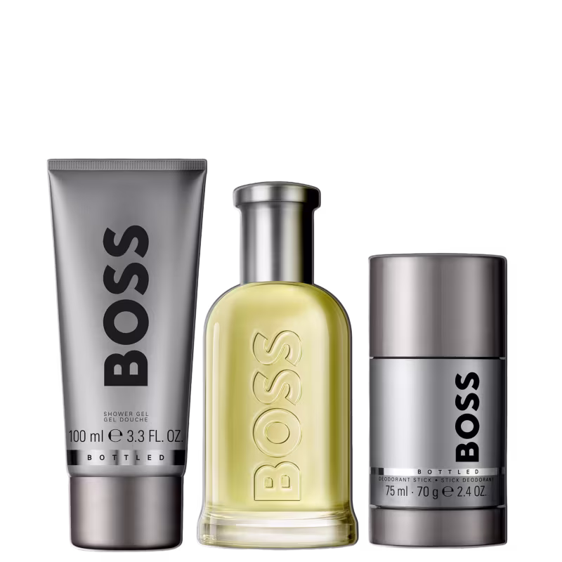 Conjunto de produtos de beleza da marca Boss, incluindo um frasco de perfume, um tubo de gel de banho e um desodorante.