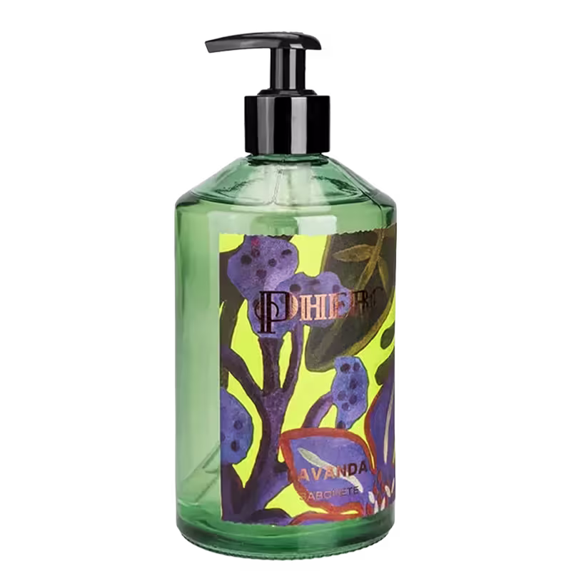 Frasco da marca Phebo com design colorido de flores e folhas, com bomba doseadora preta, posicionado sobre folhagem verde.