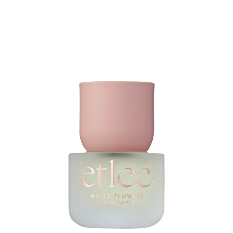 Frasco de perfume Etleé White Flowers com embalagem transparente, contendo informações sobre a marca e o nome do produto em letras douradas.