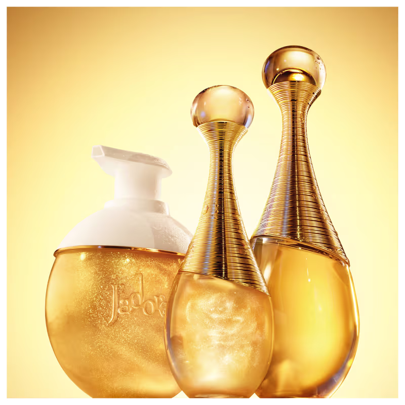 Frasco de perfume para cabelo Dior em formato de gota, com corpo dourado e detalhes em fios dourados entrelaçados, tampa transparente redonda. Embalagem elegante e sofisticada.