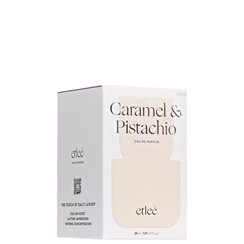 Caixa branca e bege do perfume Etleé com rótulo em preto e branco, exibindo o nome "Caramel & Pistachio" e a descrição "Eau de Parfum".