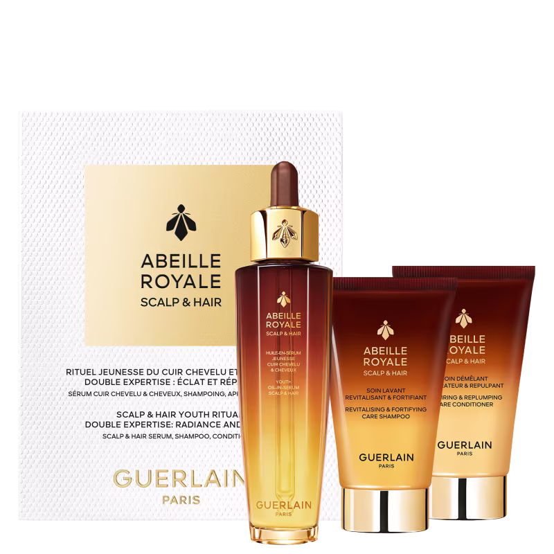 Conjunto de produtos Guerlain Abeille Royale Scalp & Hair para cuidados com o couro cabeludo e cabelos, incluindo sérum, shampoo e condicionador, em embalagens douradas e marrons com detalhes em abelha.