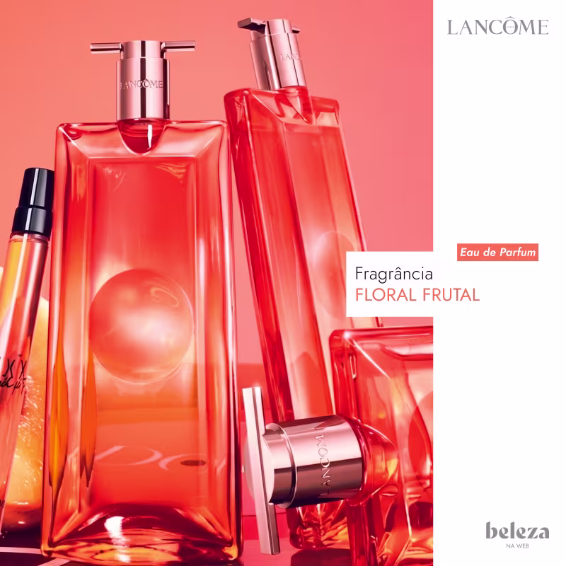 Frasco de perfume da marca Lancôme, com formato retangular e tampa rosada, em cor laranja vibrante.