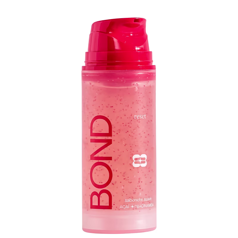 Frasco plástico rosa com tampa vermelha contendo sabonete líquido da marca Bond Rio com ingredientes de açaí e niacinamida, com texto "reset" visível no rótulo.