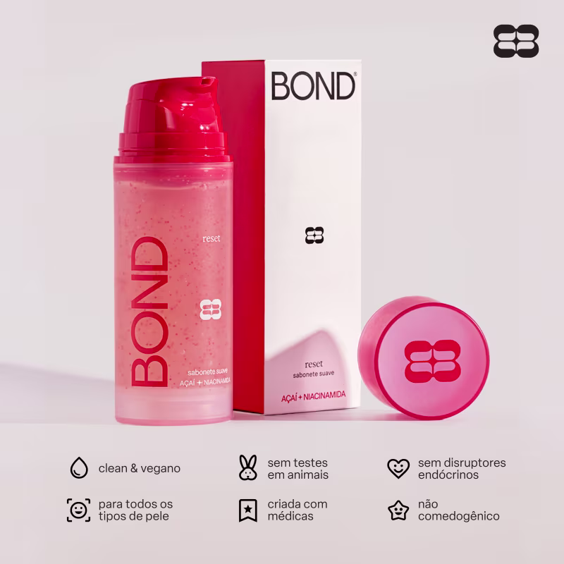 Embalagem vermelha e branca de item de perfumaria da marca Bond, com texto "reset sabonete suave" e "Acai + Niacinamida", além de ícones indicando ser produto vegano, sem testes em animais e sem disruptores endócrinos.