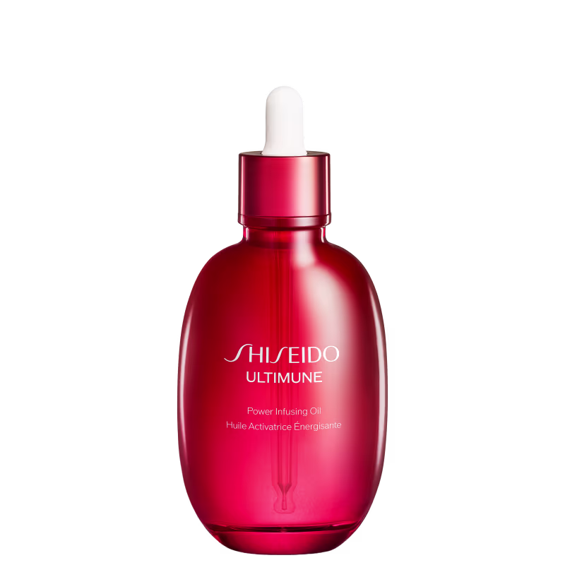 Frasco vermelho da linha Ultimune da Shiseido, contendo óleo ativador de energia com texto em branco no rótulo.