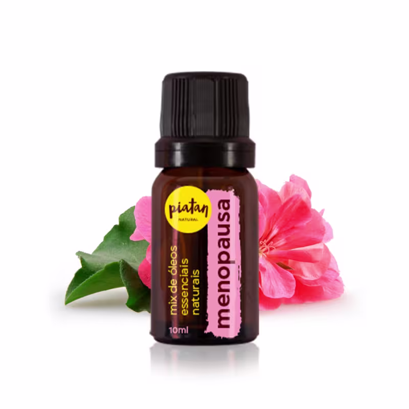 Óleo essencial natural em frasco âmbar de 10ml com tampa preta rosqueada. Rótulo rosa com o nome "menopausa".  Ao lado do frasco, há uma flor rosa de hibisco e uma folha verde, representando os ingredientes naturais do produto.
