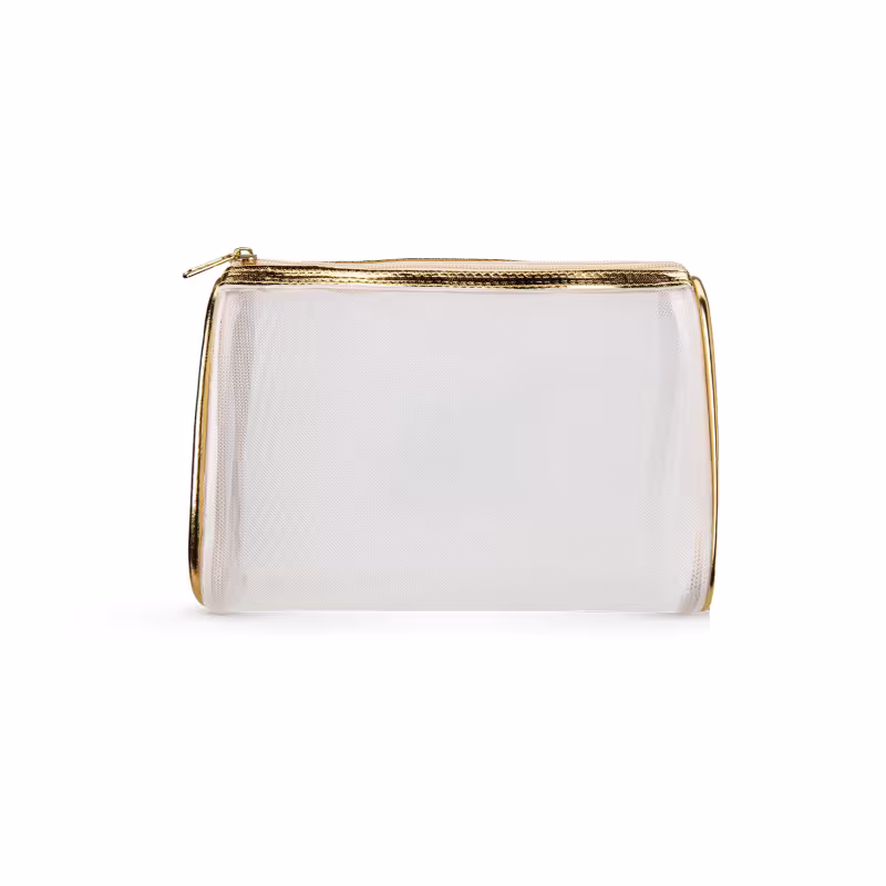 O produto apresentado é uma bolsa cosmética transparente com detalhes em dourado. Possui um zíper dourado na parte superior e uma alça também dourada. A bolsa é feita de material transparente, permitindo visualizar seu conteúdo.