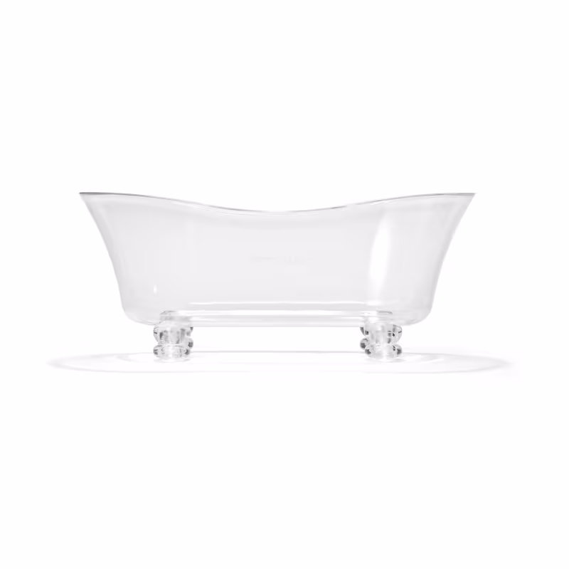 Banheira em acrílico branco. Formato oval alongado com bordas arredondadas. Base retangular transparente com quatro pés arredondados. Superfície lisa e brilhante. Design minimalista e elegante, adequado para ambientes de spa e banheiros luxuosos.