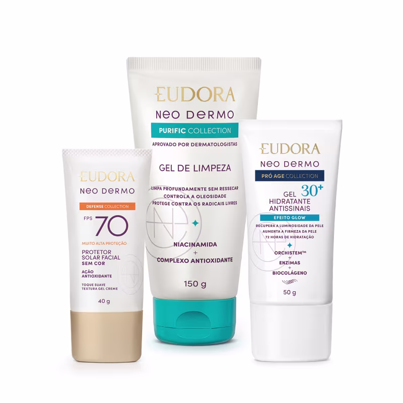 Três produtos da linha Neo Dermo da Eudora: protetor solar facial FPS 70, gel de limpeza purificante e gel hidratante antissinais 30+, em embalagens brancas e azuis com detalhes dourados.