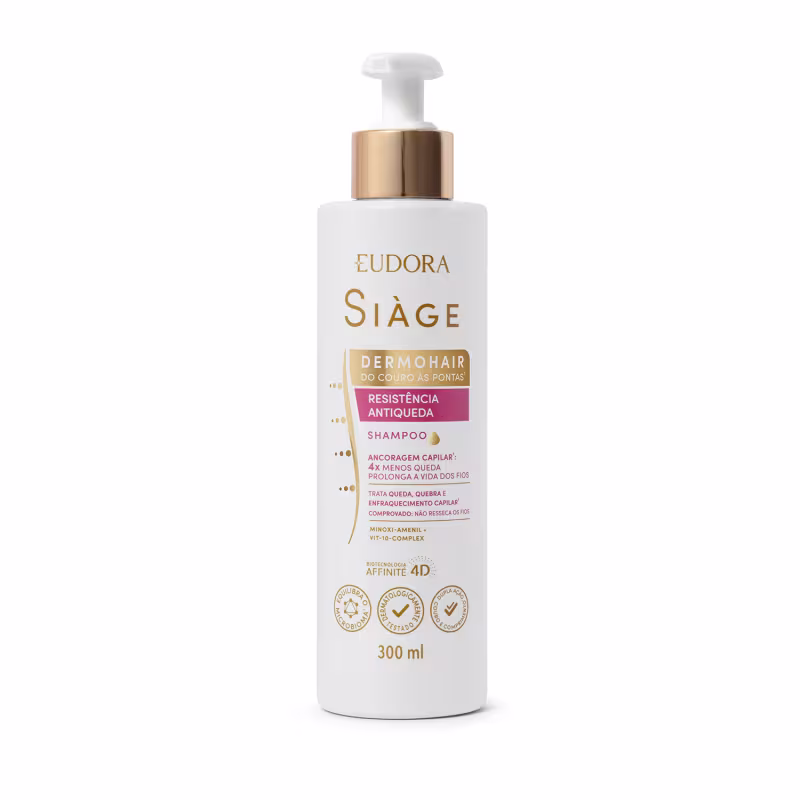 Frasco branco de shampoo da linha Siàge da Eudora, com tampa tipo pump com detalhes dourados e rótulo em doutra e rosa contendo informações sobre o produto, que promove resistência antiqueda e ancoragem capilar.