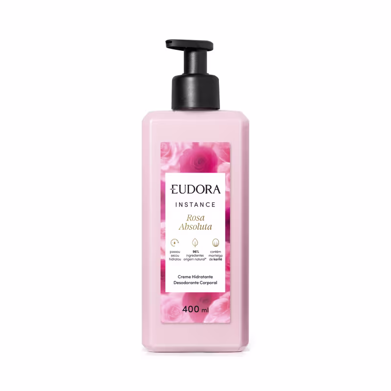 Creme hidratante desodorante corporal da linha Instance de Eudora. A embalagem é um frasco plástico rosa claro com um rótulo branco destacando o nome "Rosa Absoluta" e informações sobre o produto. O frasco possui um dispensador preto na parte superior.