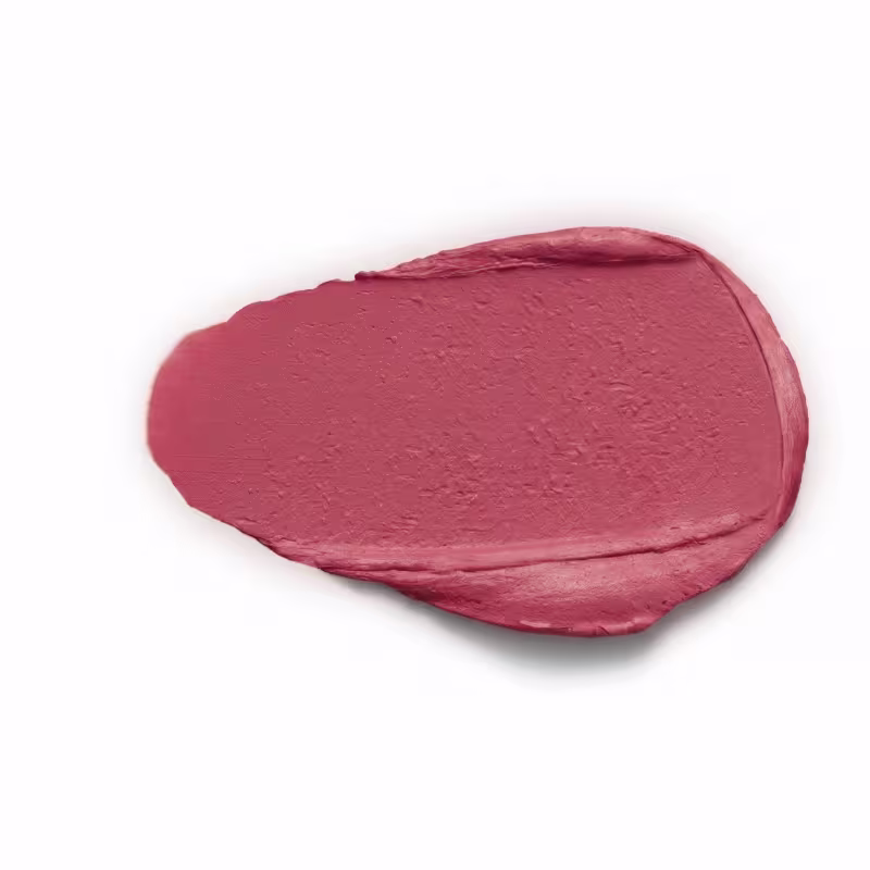 A textura deste produto de beleza apresenta uma consistência aveludada, com uma tonalidade nude rosado predominante. Sua aparência é suave e uniforme, sem brilho ou reflexos.