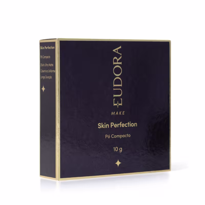 Caixa preta e dourada de pó compacto da marca Eudora Make, com texto "Skin Perfection" e informações sobre o produto.
