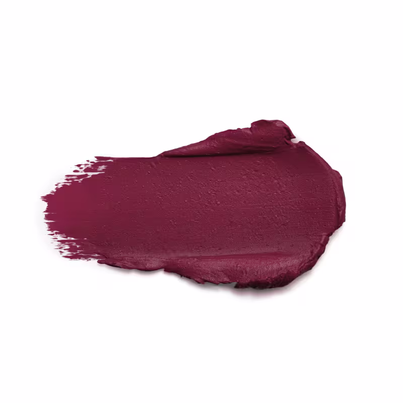 Textura cremosa e uma cor vinho escura, aplicada em uma superfície lisa e uniforme. Não é possível identificar qualquer rótulo ou texto visível na imagem.