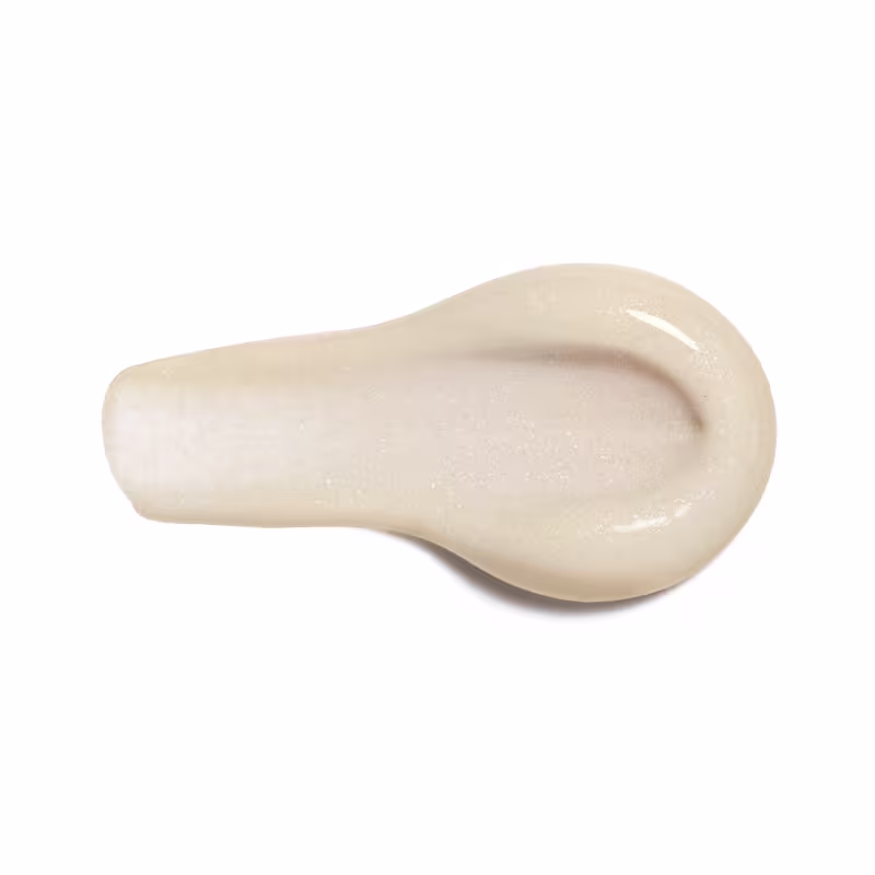 A imagem apresentada é da textura da Loção Hidratante Diva Suprema, em formato de gota, com uma superfície lisa e brilhante em tons de bege.