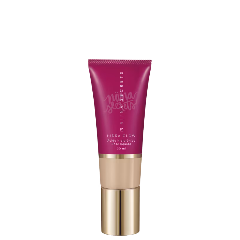 Tubo de base líquida Hidra Glow da marca Niina Secrets, com embalagem rosa e detalhes dourados, contendo 30 ml do produto.