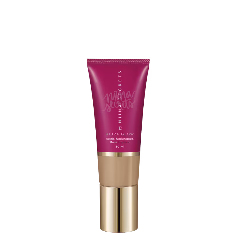 Tubo de base líquida Hidra Glow da marca Niina Secrets, com embalagem rosa e detalhes dourados, contendo 30 ml de produto.