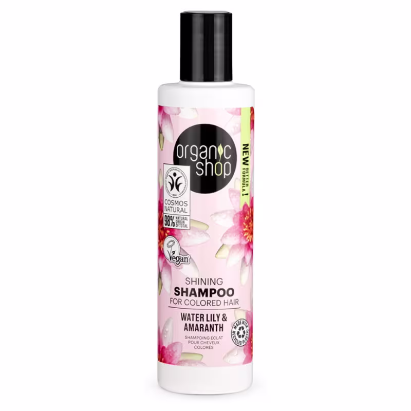 A imagem mostra o shampoo em frasco plástico transparente com rótulo rosa e branco com imagens de flores.