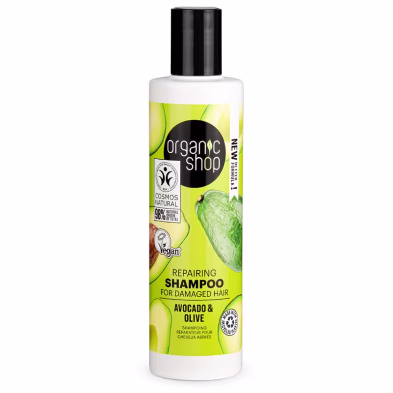 A imagem mostra um shampoo em frasco branco com tampa preta. O rótulo do shampoo é verde e traz abacates estampados.