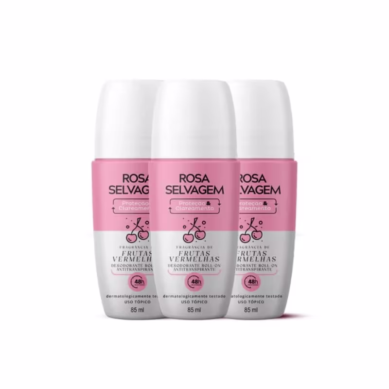 Três frascos de desodorante roll-on da marca Rosa Selvagem, com embalagem branca e rosa, exibindo o nome da marca e a fragrância de "Frutas Vermelhas" em destaque.