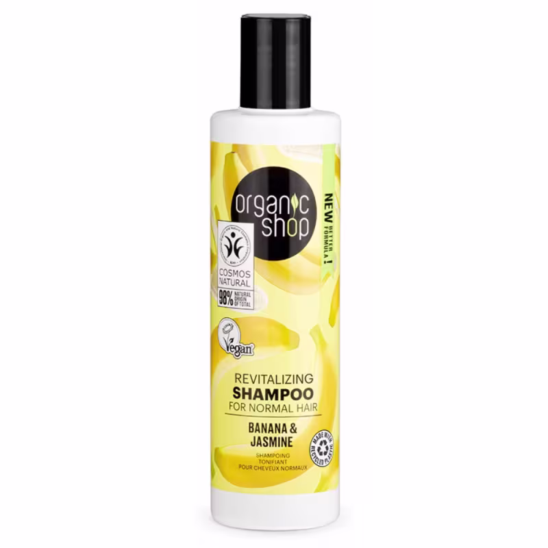 A imagem mostra o shampoo em embalagem plástica transparente com tampa preta. Rótulo amarelo com imagens de banana.