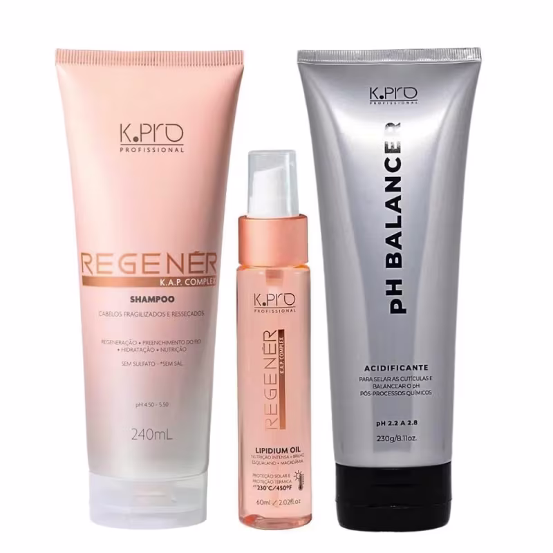 Conjunto de produtos de cuidados capilares da marca K.pro, incluindo shampoo e óleo capilar em embalagens de plástico nas cores rosa e branco. Também conta com tubo de acidificante pH Balancer.