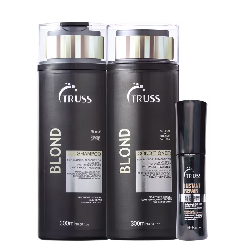 Na imagem um shampoo e um condicionador para cabelos loiros, ambos de 300ml, em embalagens pretas com detalhes prateados. Além disso, há um óleo reparador de 45ml.
