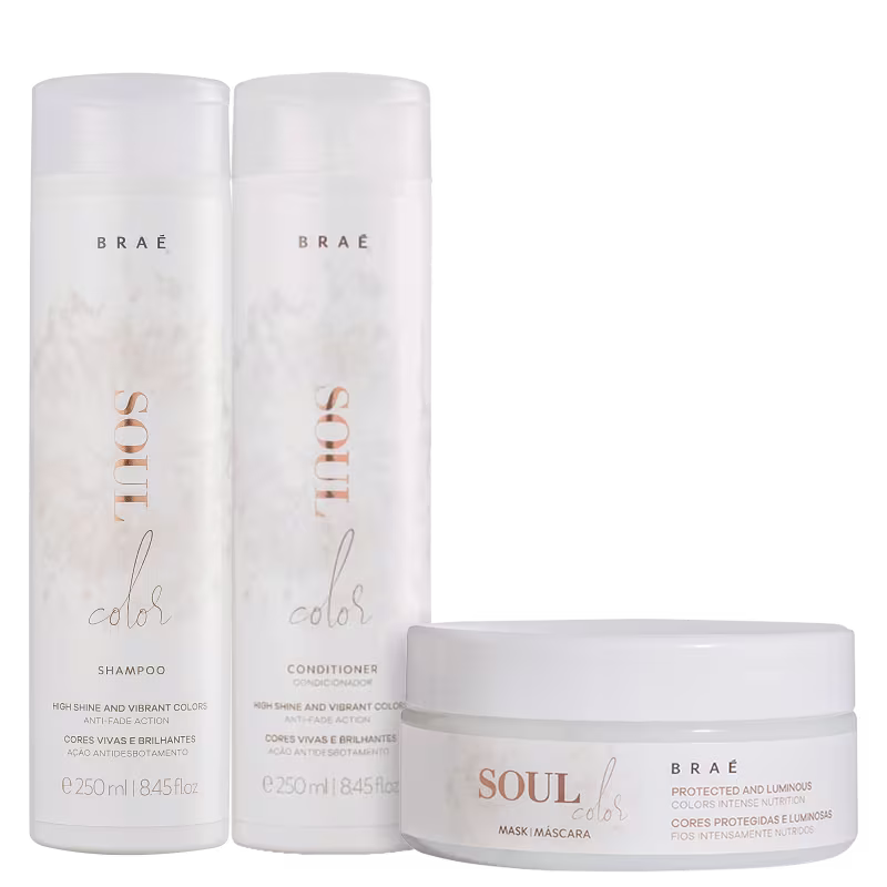 A imagem mostra três produtos de cuidados capilares da marca Braé. Dois são frascos cilíndricos de plástico branco, um contendo shampoo e o outro condicionador, ambos da linha "Color".  O terceiro produto é uma máscara capilar da mesma linha.
