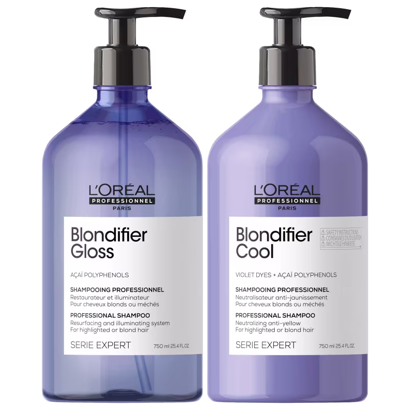 Dois frascos de shampoo profissional da linha Serie Expert da L'Oréal Professionnel Paris. Os frascos são transparentes e têm um design cilíndrico com bombas dosadoras pretas na parte superior.