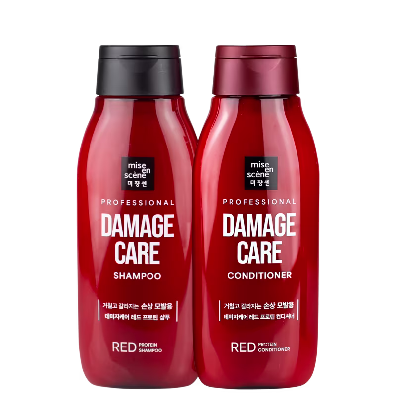 Dois frascos vermelhos da linha Mise en Scène Professional Damage Care, contendo shampoo e condicionador. Os rótulos indicam que são produtos para cuidados com cabelos danificados.