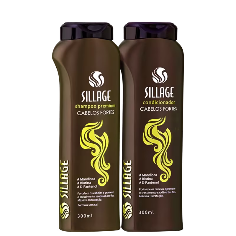 Dois frascos de produtos Sillage para cabelos fortes, um shampoo premium e um condicionador, em embalagens de 300ml com rótulos em cores marrom e amarelo destacando os ingredientes como mandioca, biotina e D-pantenol.