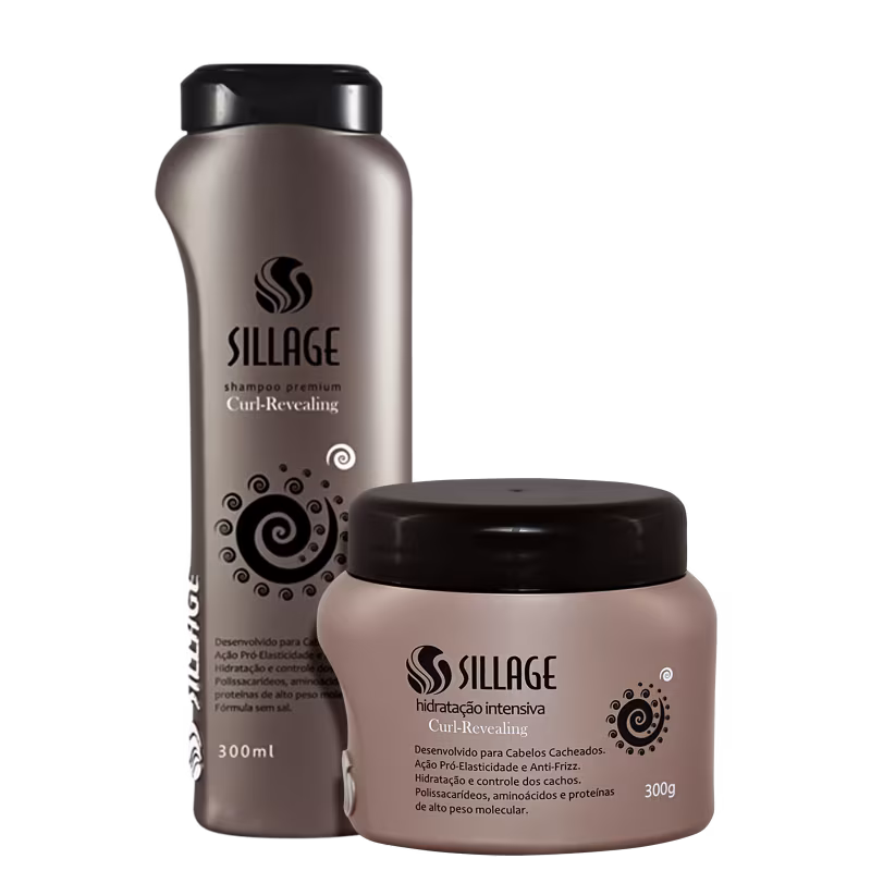 Dois produtos da marca Sillage: um frasco de shampoo premium Curl-Revealing de 300ml e um pote de hidratação intensiva Curl-Revealing de 300g, ambos com embalagens em tons de cinza e preto.