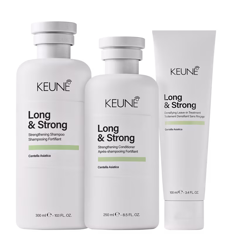 Produtos da linha Long & Strong da Keune, incluindo shampoo, condicionador e tratamento capilar, em embalagens brancas com detalhes em verde, destacando ingredientes como Centella Asiática.