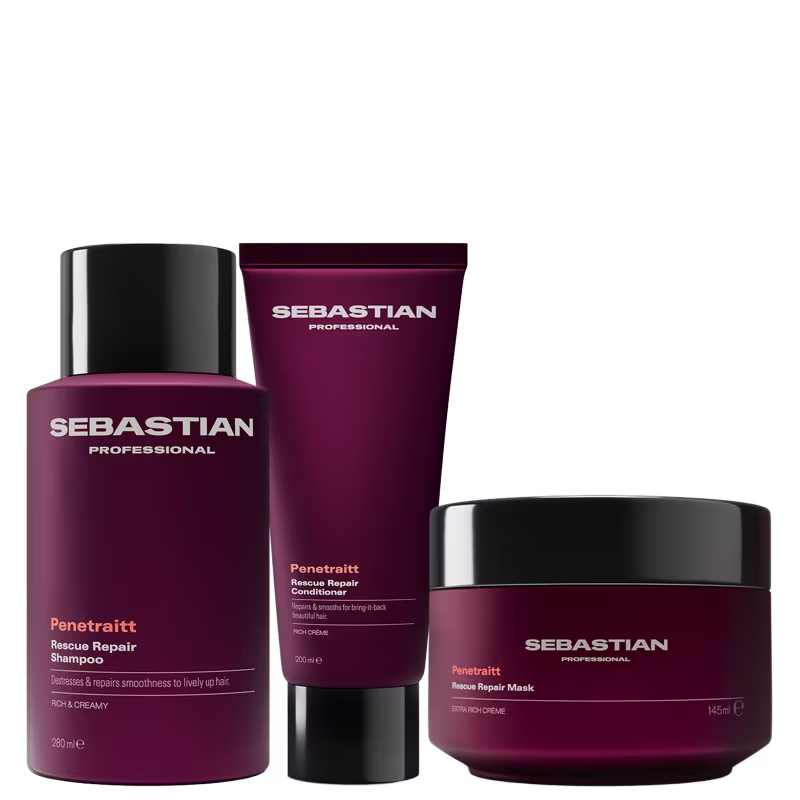 Três produtos da marca Sebastian Professional: um frasco de shampoo Penetraitt Rescue Repair, um tubo de condicionador Penetraitt Rescue Repair e um pote de máscara Penetraitt Rescue Repair, todos em embalagens de cor vinho com detalhes em laranja.