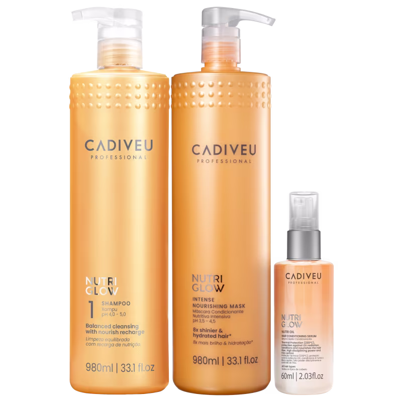 Três produtos da linha Nutri Glow da Cadiveu Professional: um frasco de shampoo, um frasco de máscara condicionante e um frasco de sérum capilar, todos em embalagens com design moderno e predominância de cores laranja e branca.