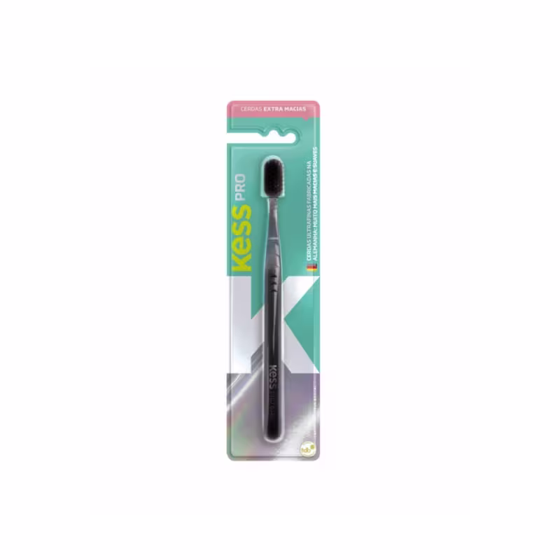 Escova dental Kess Pro com cerdas extra macias, embalada em cartela plástica de cor verde e rosa. O produto apresenta o nome da marca "Kess Pro" em destaque.