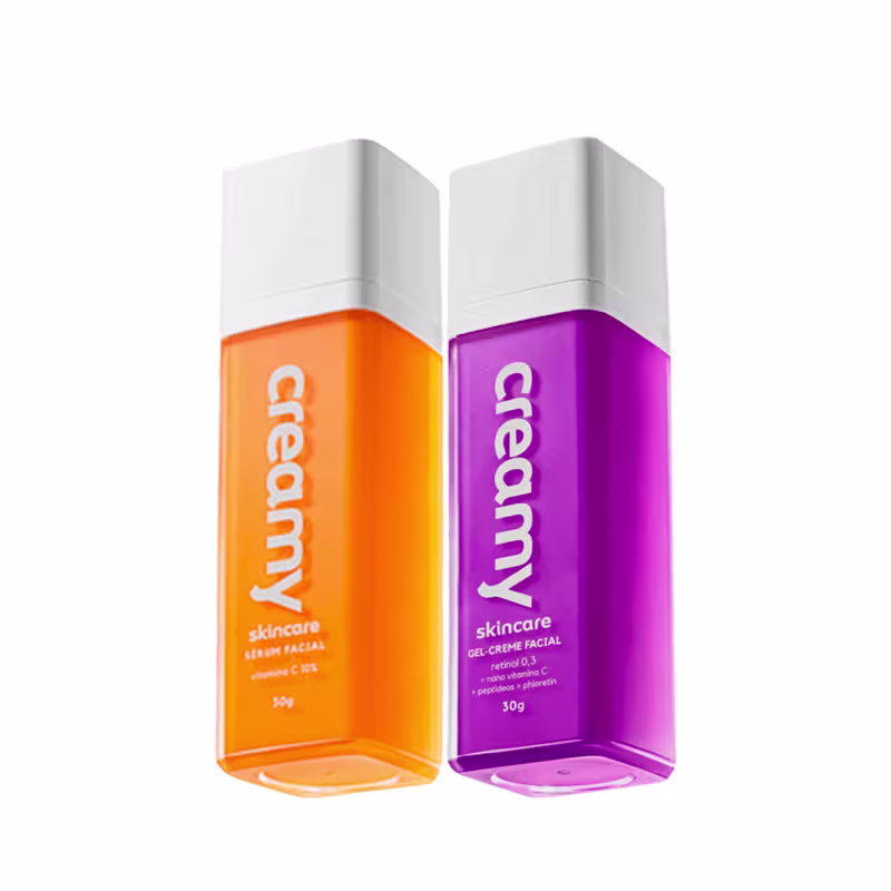 Dois frascos de produtos de skincare da marca Creamy, um em laranja e outro em roxo, Retinol e Vitamina C.