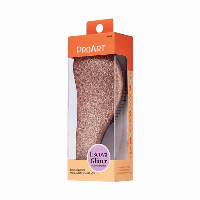 A imagem mostra uma embalagem plástica transparente contendo uma escova de cabelo com cerdas pretas e corpo brilhante. A embalagem é laranja com o logotipo "ProArt" e a descrição "Escova Glitter" em português.