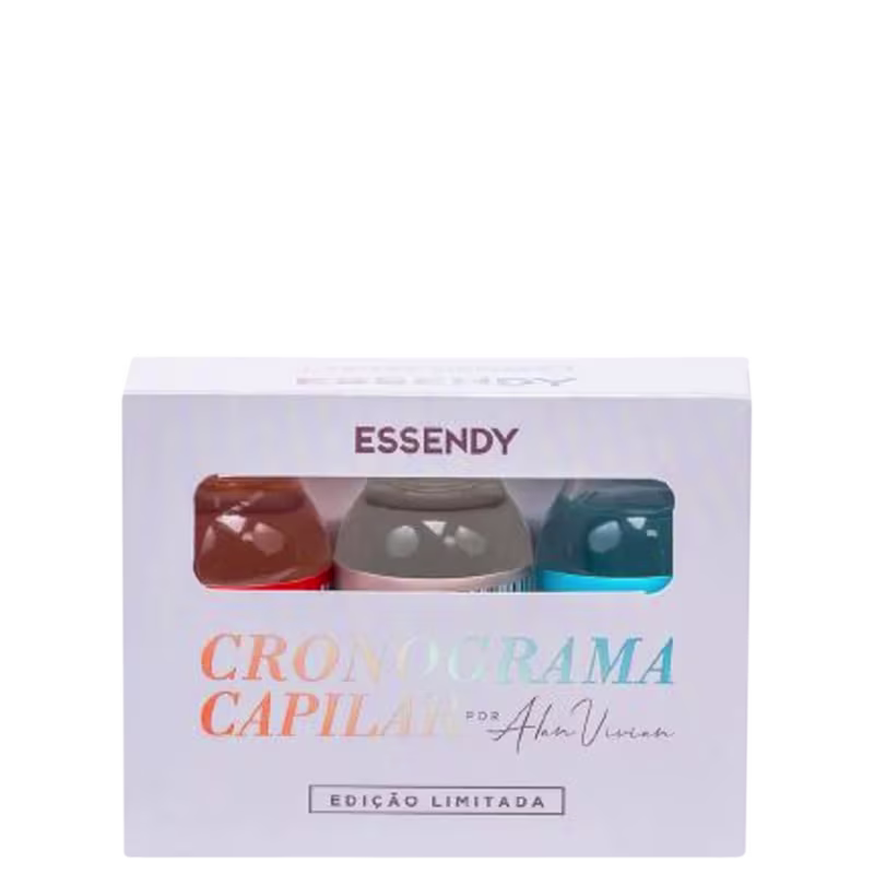 Caixa contendo três frascos de Cronograma Capilar da marca Essendy, uma linha de produtos para cuidados capilares. Cada frasco possui uma cor diferente - marrom, cinza e azul. Abaixo do nome do produto, há a assinatura "Por Alam Vieira".