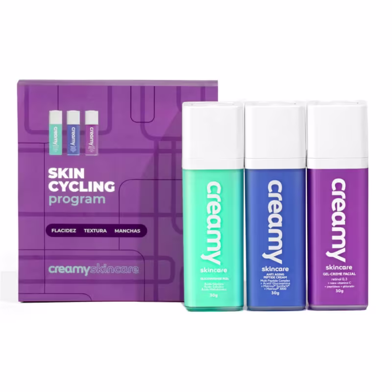 A imagem mostra três frascos retangulares transparentes de sérum cor verde, azul e roxo, com tampas brancas, além de uma caixa roxa que acompanha os produtos.