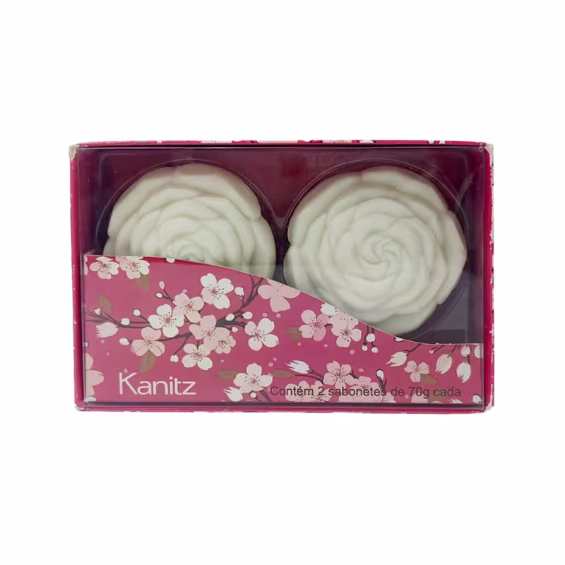 Caixa de presente Kanitz contendo dois sabonetes em formato de rosas brancas, embalados em caixa com estampa floral rosa e branca.