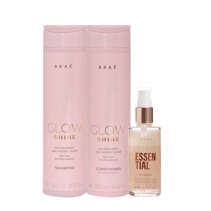 O produto apresentado é uma linha de cuidados capilares da marca Braé. Consiste em dois frascos de 250ml cada, um shampoo e um condicionador, na cor rosa claro. Acompanha também um frasco menor de óleo capilar "Essential Oil Blend".