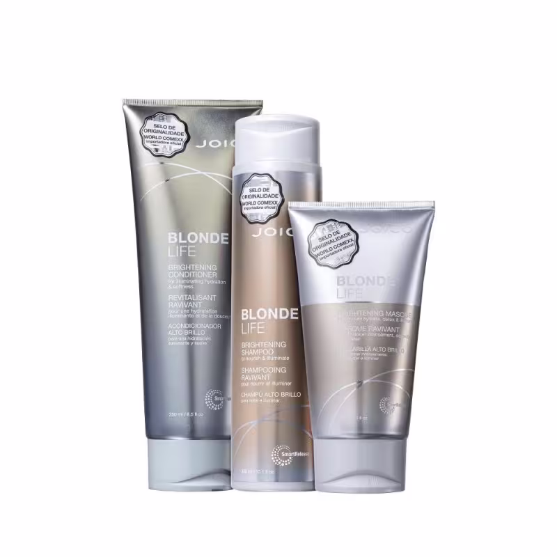 A imagem mostra três produtos da linha Blonde Life da marca Joico: um condicionador, um shampoo e uma máscara, todos em embalagens com tons dourados e prateados.