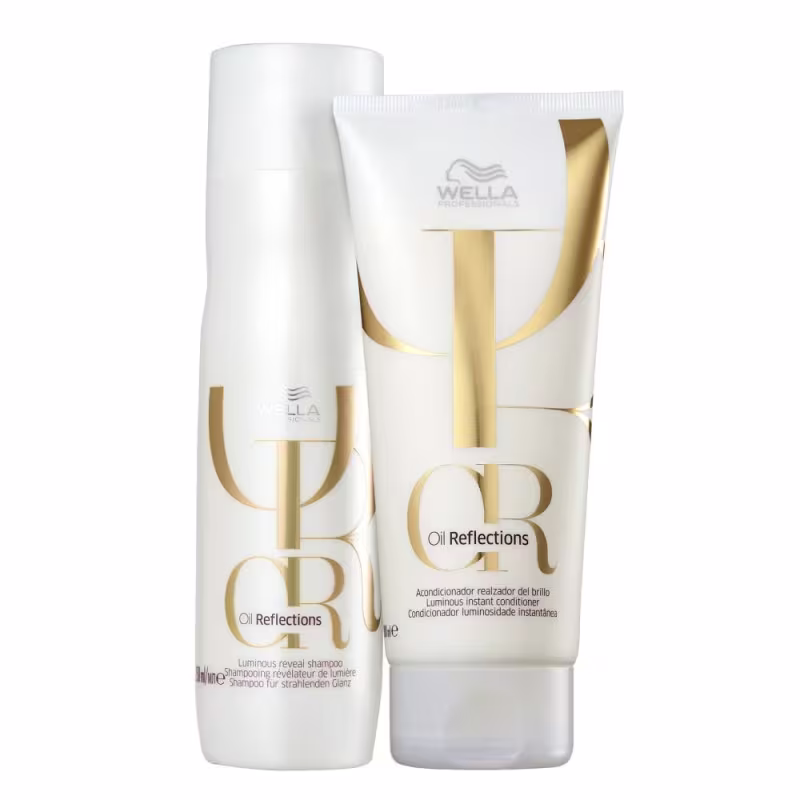 Dois produtos da linha Oil Reflections da Wella Professionals: um frasco de shampoo e um tubo de condicionador, ambos com embalagens brancas e detalhes dourados, exibindo o nome da linha e suas propriedades.