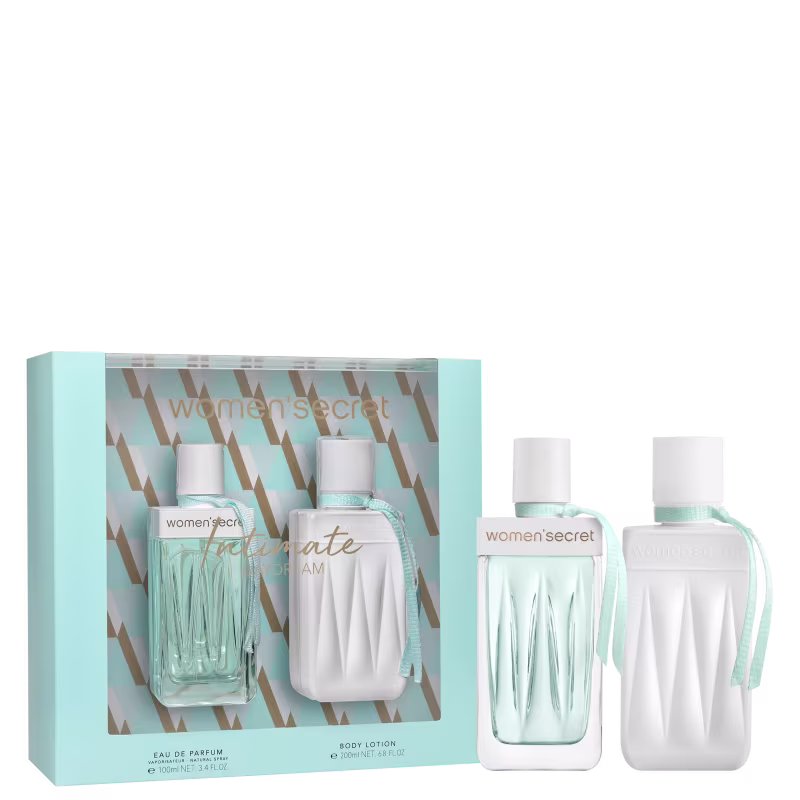 A imagem mostra uma caixa de presente com um design geométrico em tons de azul claro e marrom. Dentro da caixa, há um frasco de vidro e um frasco opaco branco. Do lado de fora estão os mesmos produtos.