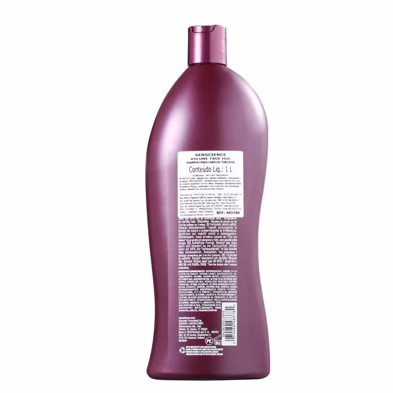 A imagem mostra o verso do shampoo com as informações detalhadas sobre a fórmula.