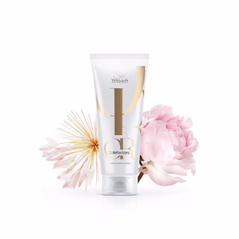 Condicionador Oil Reflections da marca Wella Professionals, com fundo floral.