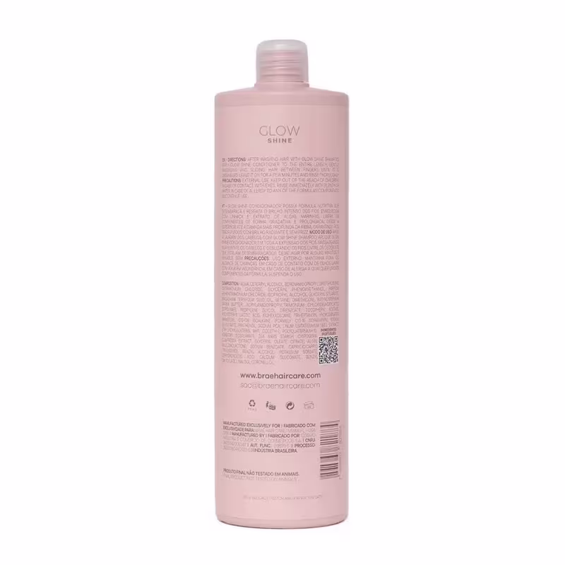 Produto de cuidado capilar Glow Shine da marca Brae. Embalagem plástica transparente na cor rosa claro. Rótulo com o nome do produto "Glow Shine" e informações em texto pequeno, como ingredientes e instruções de uso.